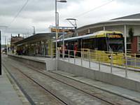 Tram 3003 stands at Central stop Oldham on the first day of operation with Sainsburys in the background. Photo R Clarke